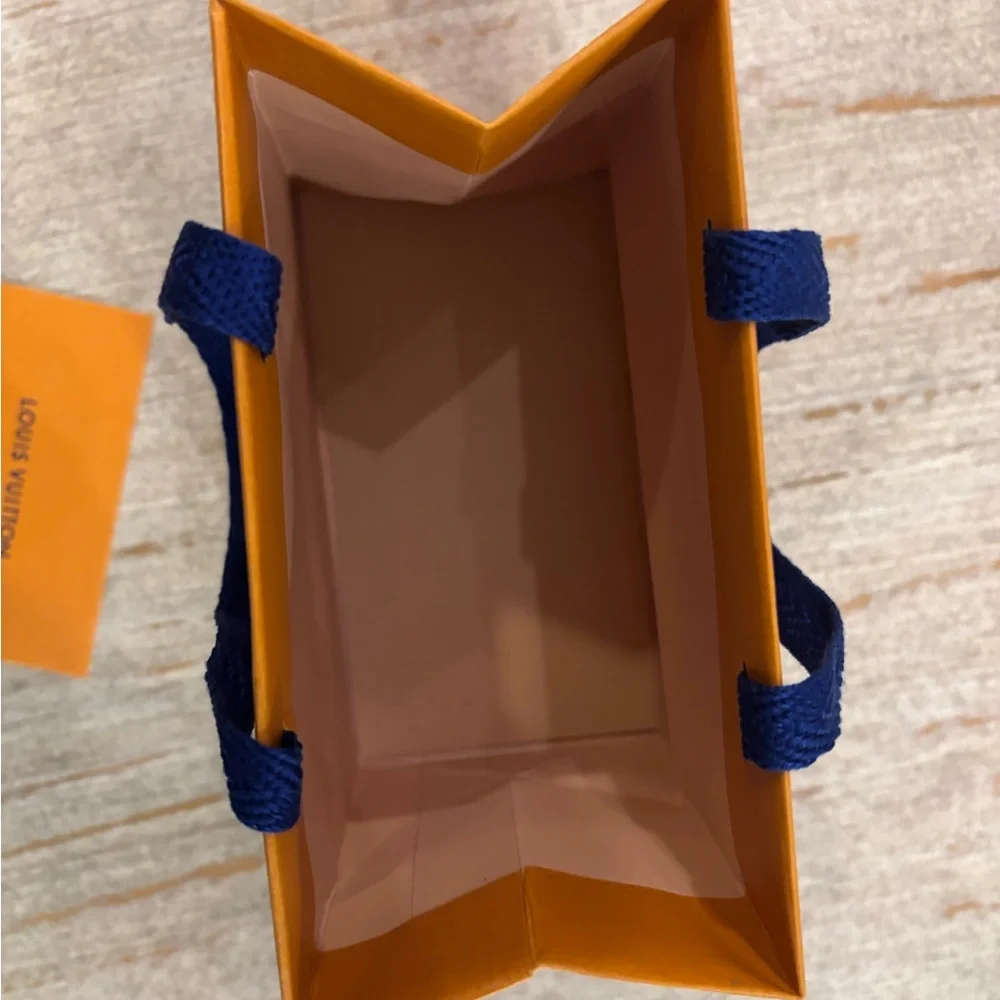 Louis Vuitton Vibrant Orange Bag with Blue Handles
